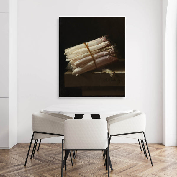 Moderner Sitzbereich mit Akustikbild im Hochformat mit gebündeltem Spargel und weißem Rahmen.